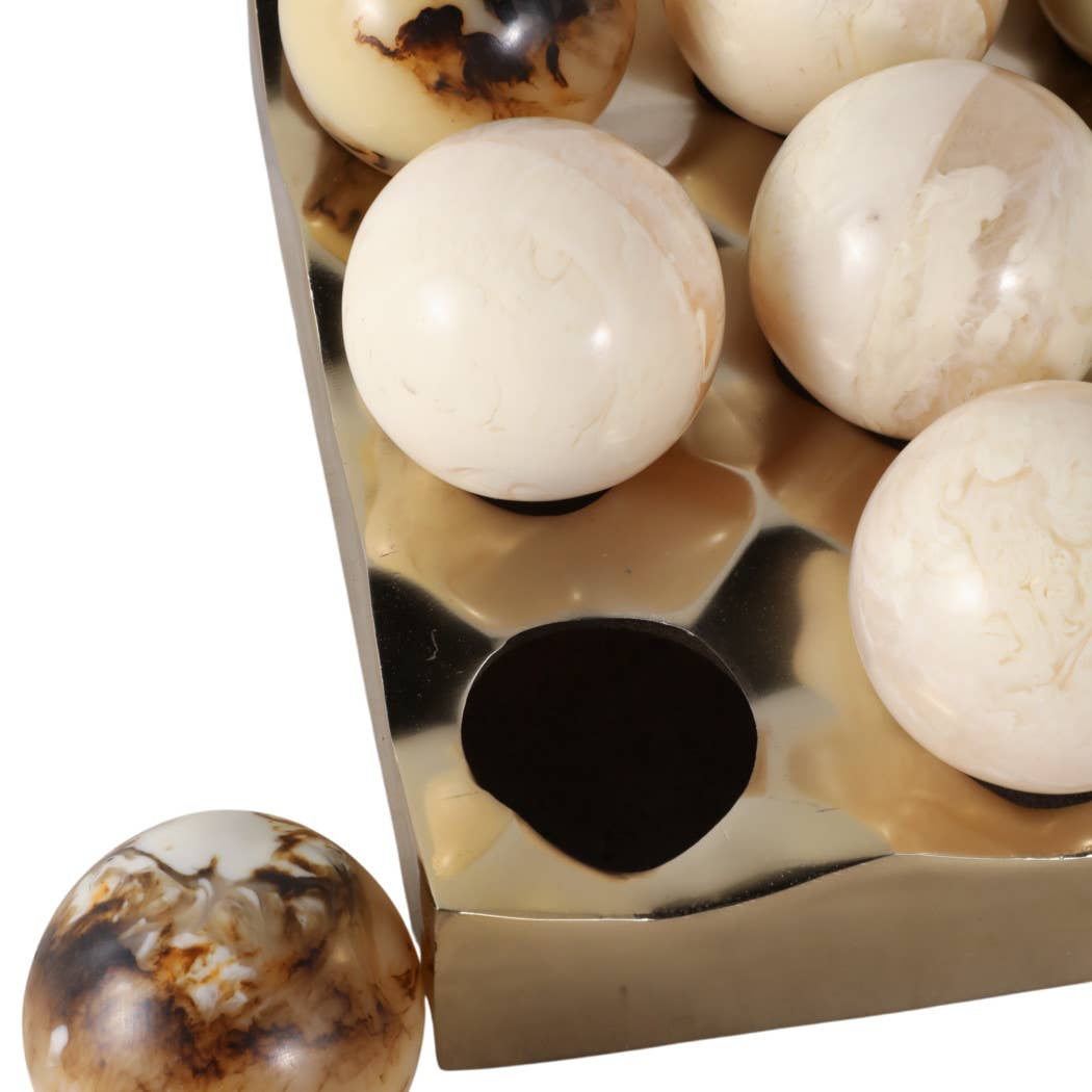 Detail of polished marble tic-tac-toe pieces showing natural veining