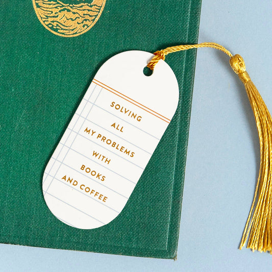 Solving All My Problems with Books & Coffee bookmark with gold tassel on a green book