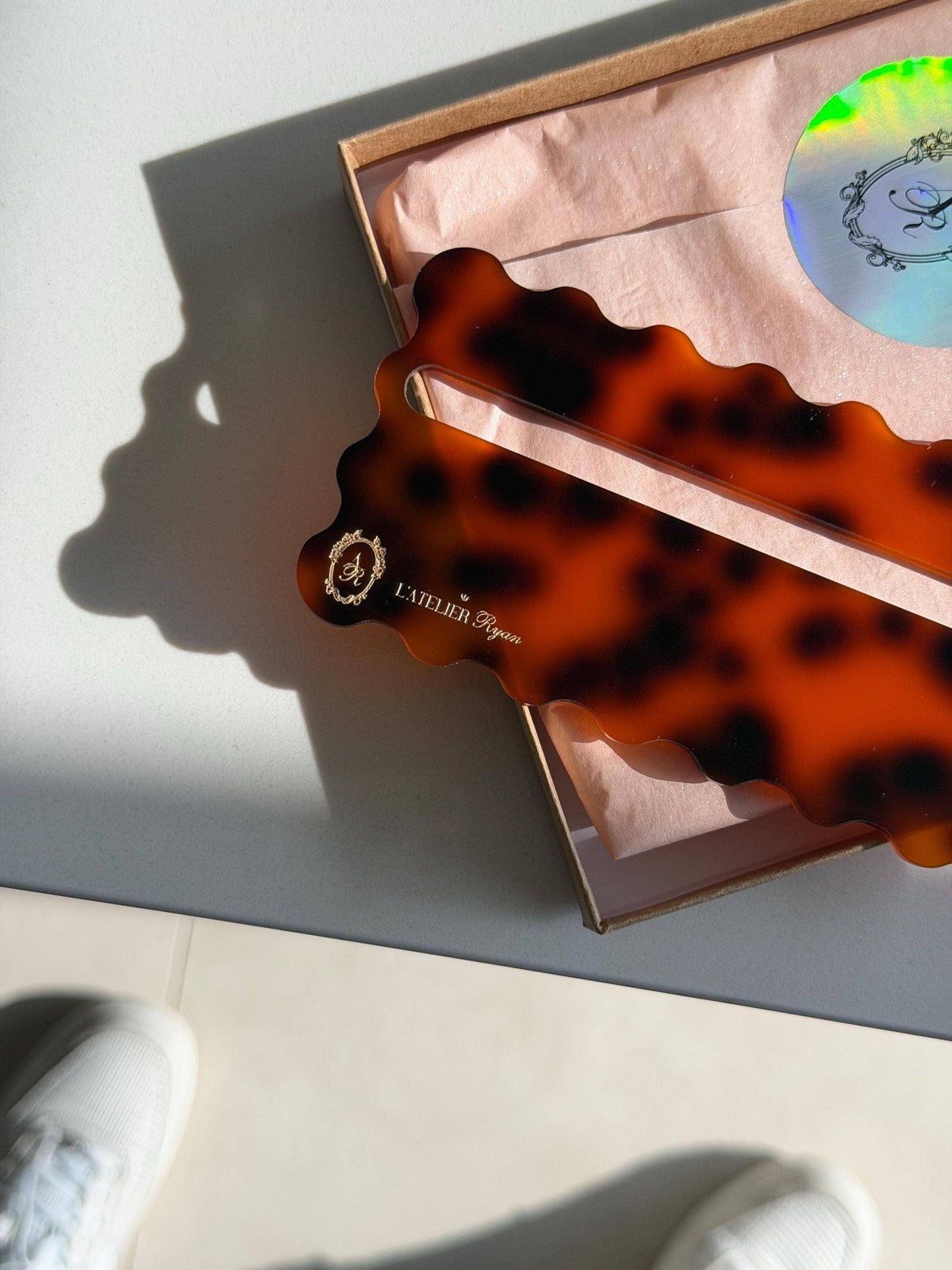 Tortoiseshell Mahjong line reader casting a shadow in bright sunlight