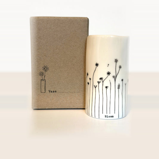 Bloom mini porcelain vase with hand-drawn wildflowers next to its kraft gift box