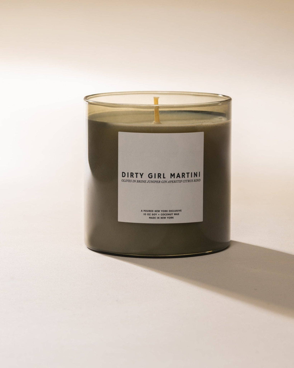 Dirty Girl Martini soy coconut wax candle in a dark glass jar, front label
