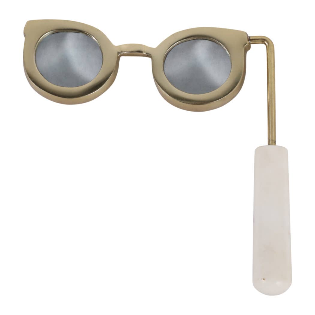 Gold eyeglass-shaped magnifying glass with white marble handle, front view