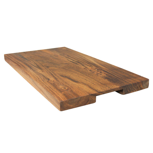 Acacia wood cutting board with finger slots, 18 x 10 inches, shown at an angle on a white background