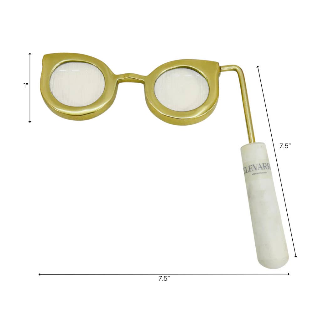 Gold eyeglass-shaped magnifying glass with white marble handle shown with dimensions