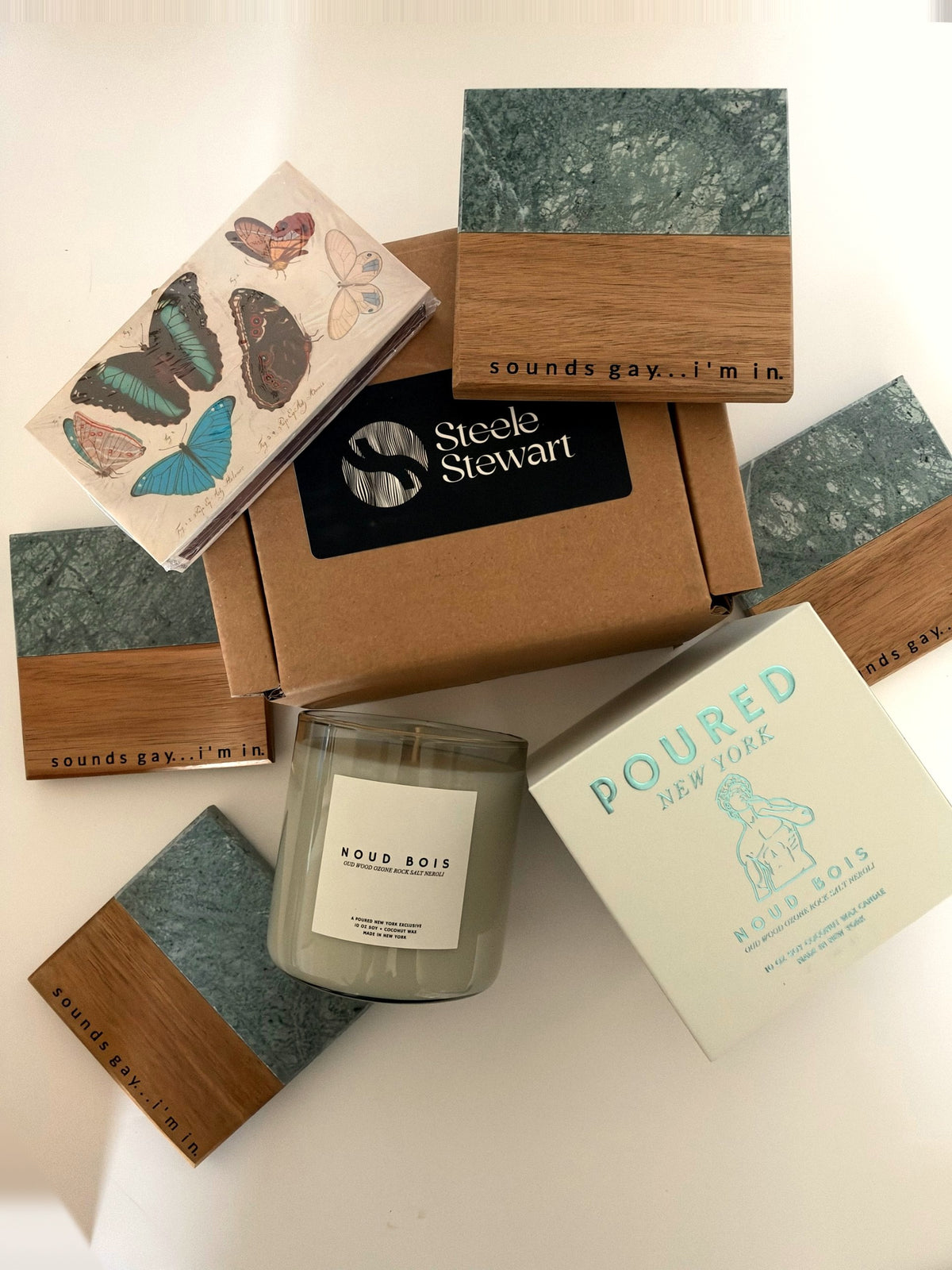 Sounds Gay I'm In gift set: four engraved green marble and wood pride coasters, Noud Bois candle with box, Blue Butterflies safety matches and Steele Stewart gift box