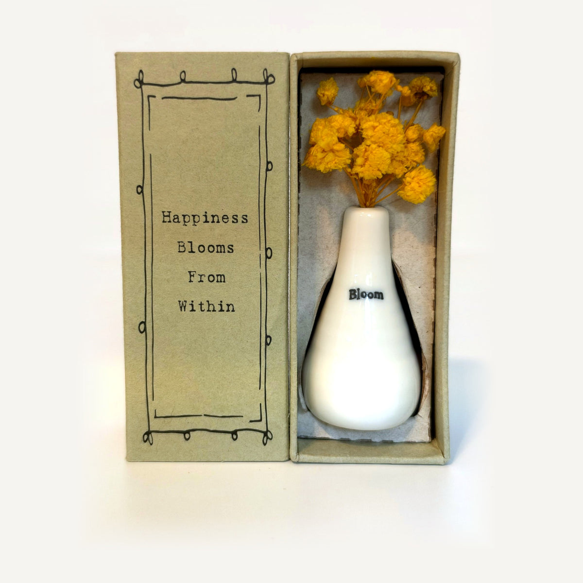 Bloom tiny vase gift box: white porcelain vase with yellow dried flowers beside a card reading Happiness Blooms From Within