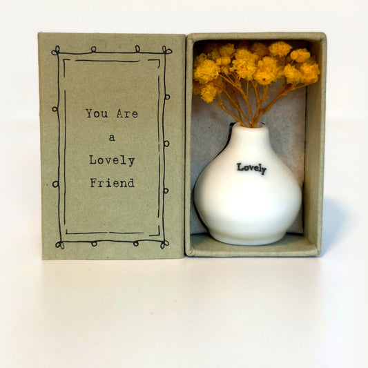 Lovely tiny vase gift box: white porcelain vase with yellow dried flowers beside a card reading You Are a Lovely Friend